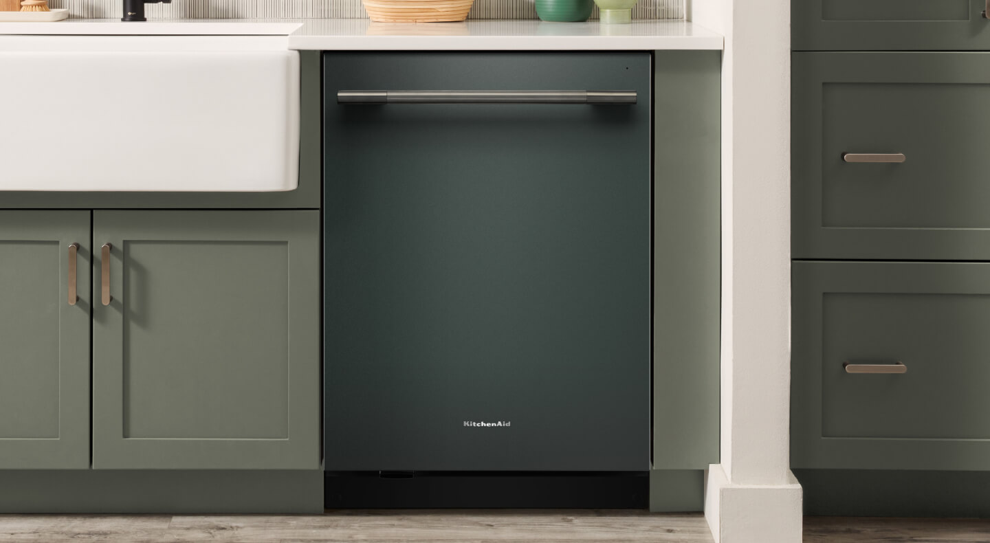 KitchenAid® dishwasher set in modern cabinetry