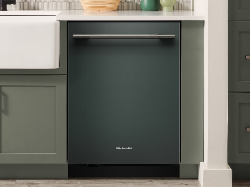 KitchenAid® dishwasher set in modern cabinetry