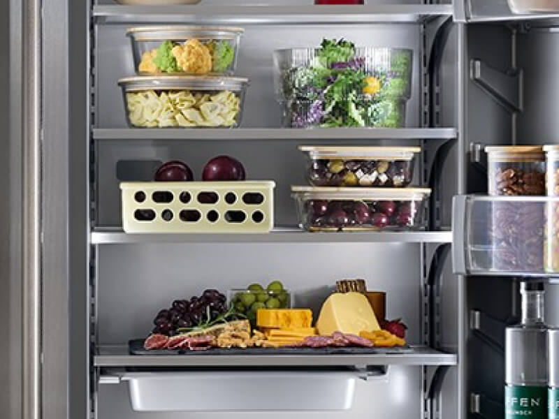 An open refrigerator stocked with food