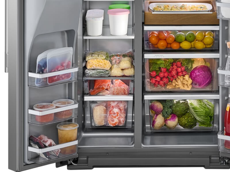 An open side-by-side refrigerator freezer with food stored inside