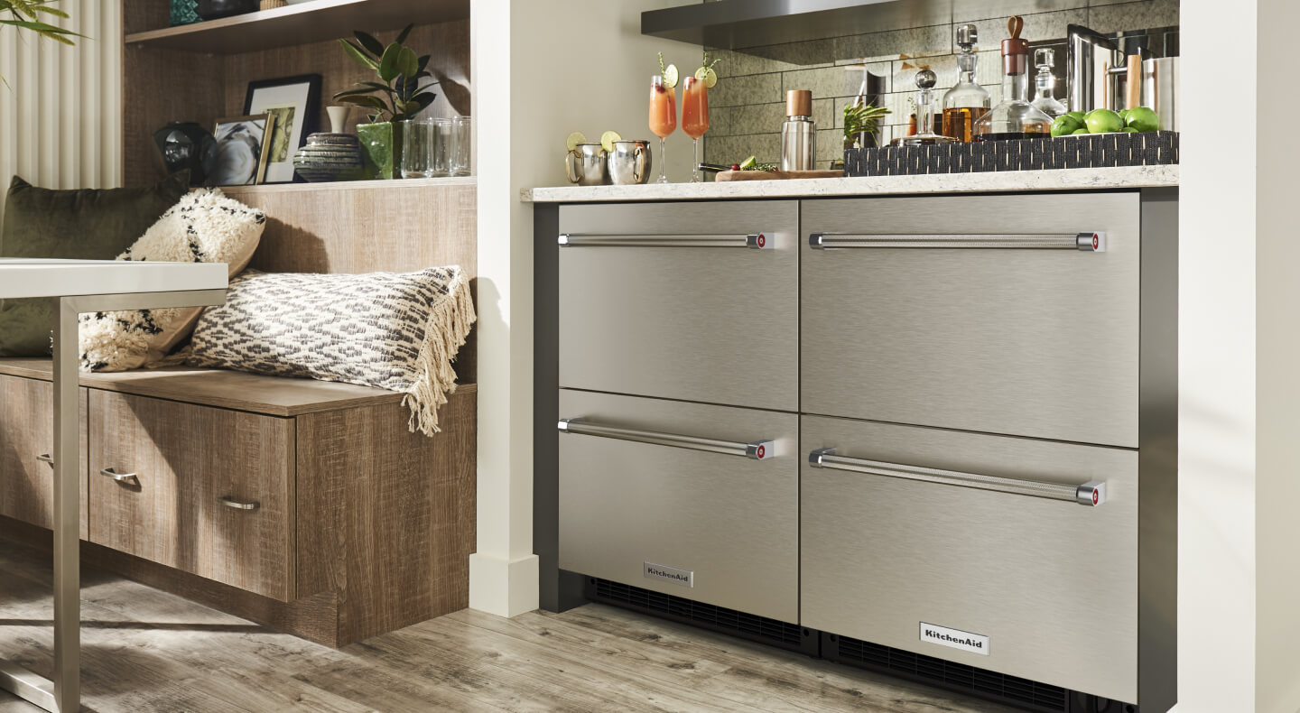 Sleek stainless steel undercounter refrigerator in a home
