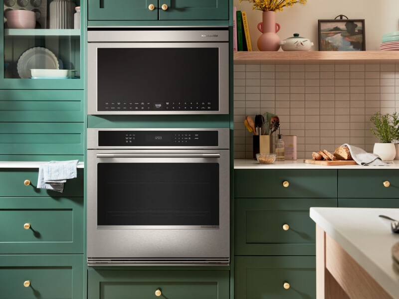 KitchenAid® single wall oven and built-in microwave in green cabinetry