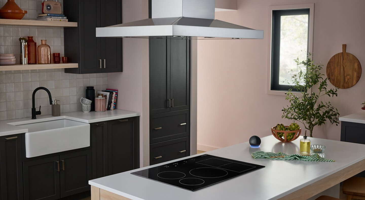 KitchenAid® cooktop in a white kitchen island countertop