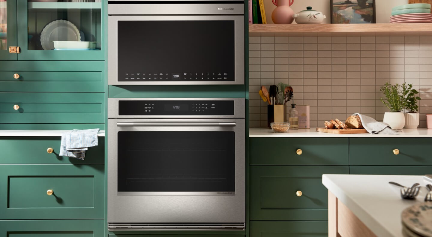 KitchenAid® single wall oven and built-in microwave in green cabinetry