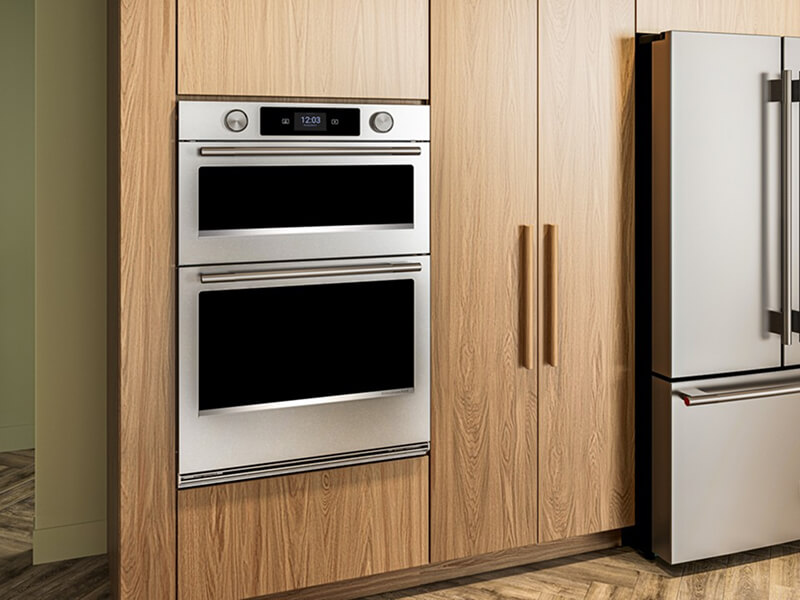 A KitchenAid® combination wall oven and refrigerator in a kitchen