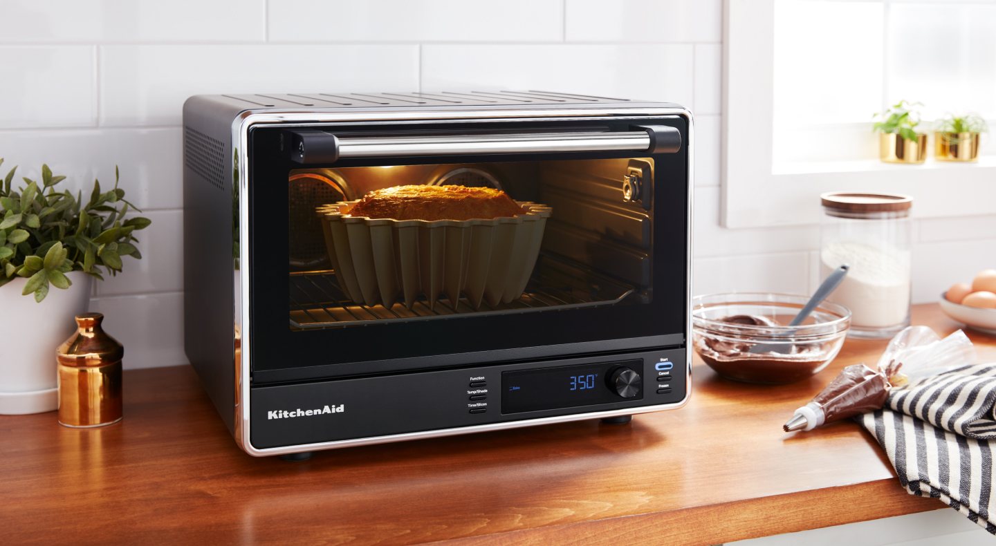 Bundt cake baking in a KitchenAid® countertop oven
