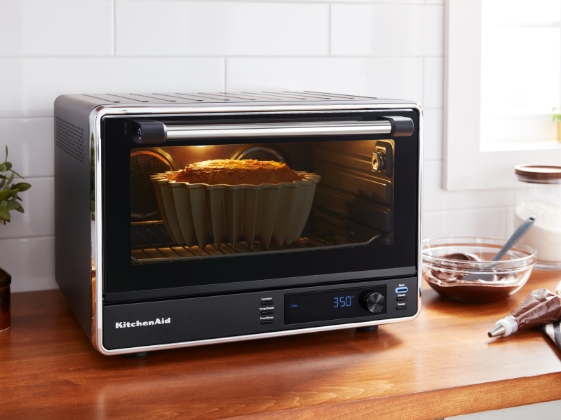 Bundt cake baking in a KitchenAid® countertop oven