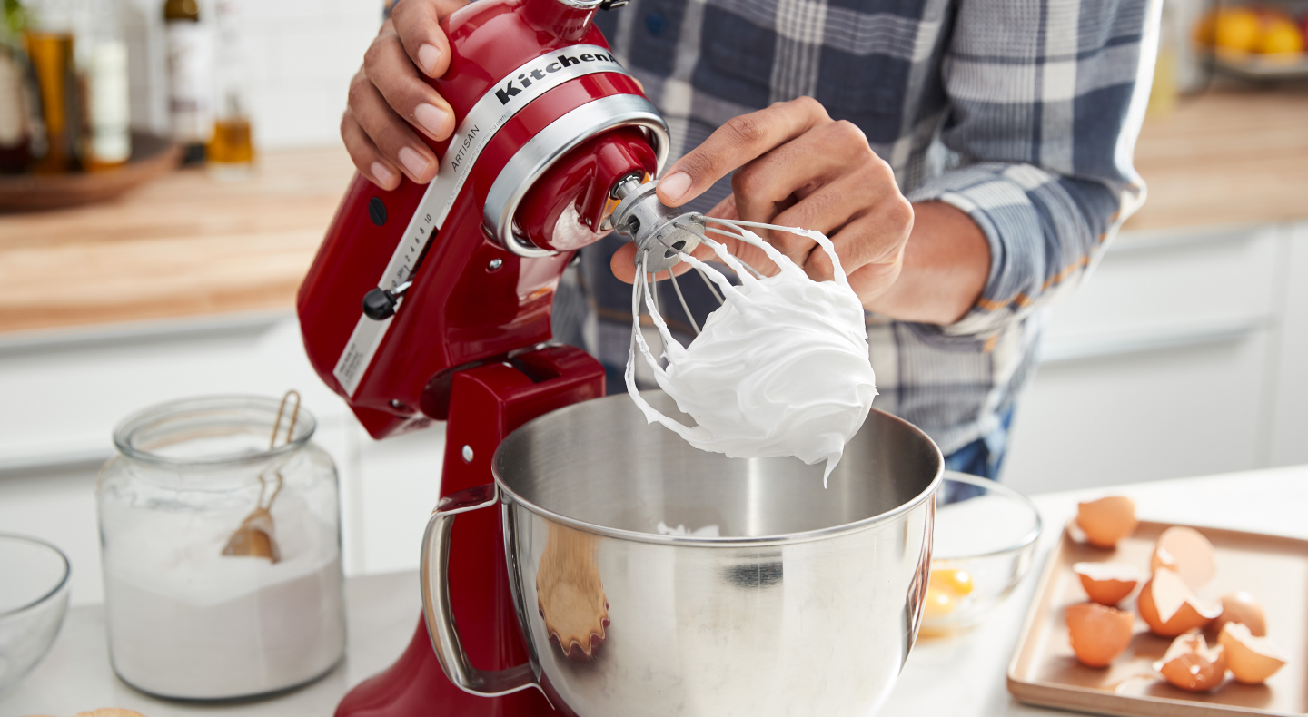 Red KitchenAid® stand mixer making homemade meringue