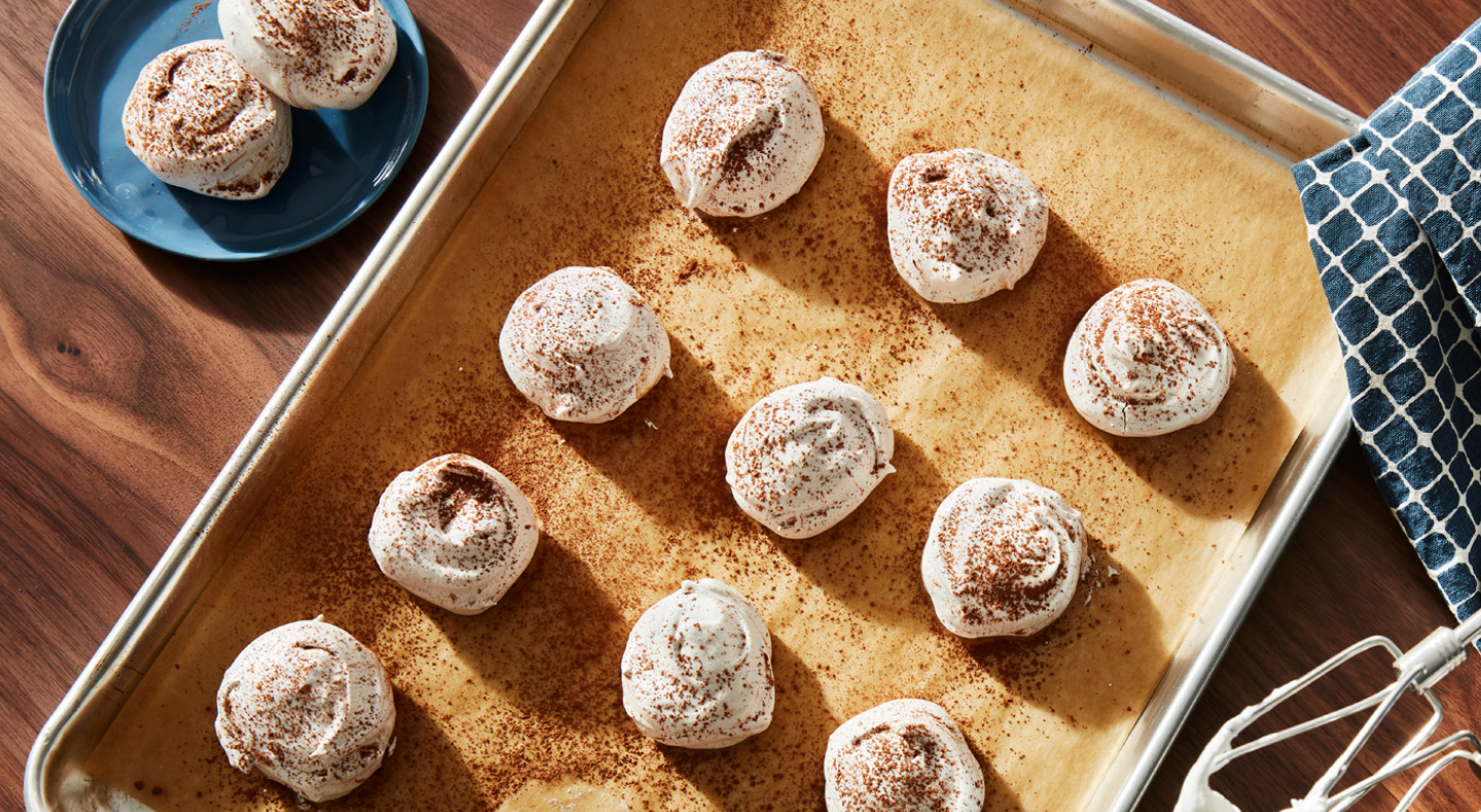 Meringue cookies topped with cocoa powder