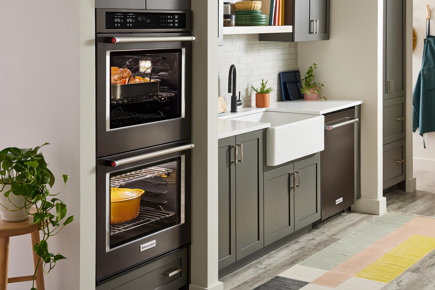 A modern kitchen with a sink and a double wall oven