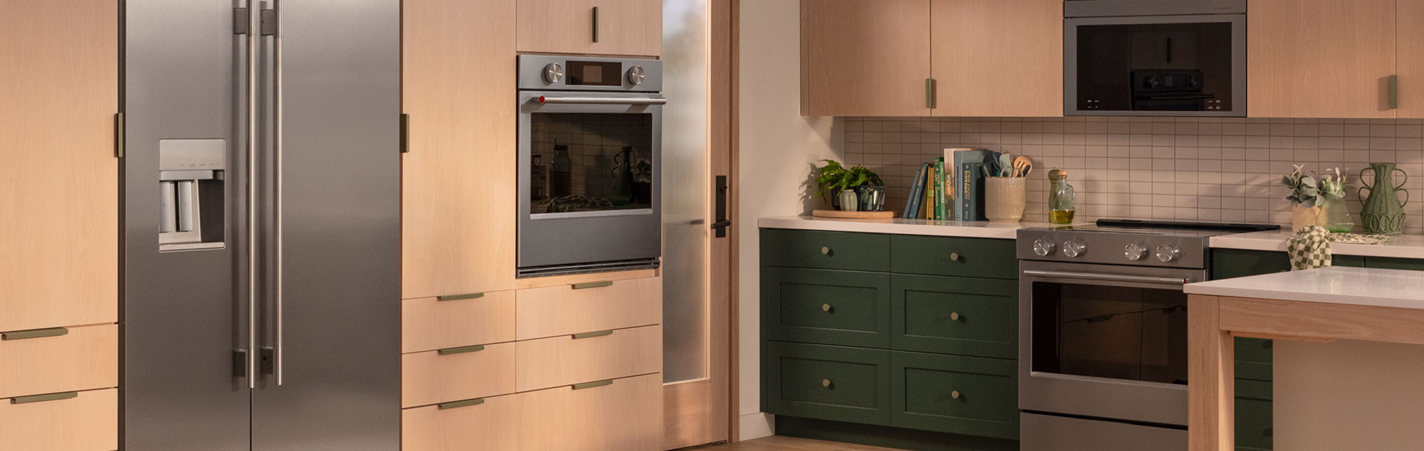 Stainless steel KitchenAid® refrigerator built into a modern kitchen