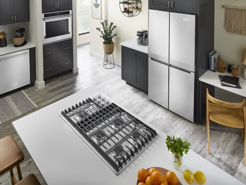 Overhead view of a downdraft gas range set into the island of a kitchen