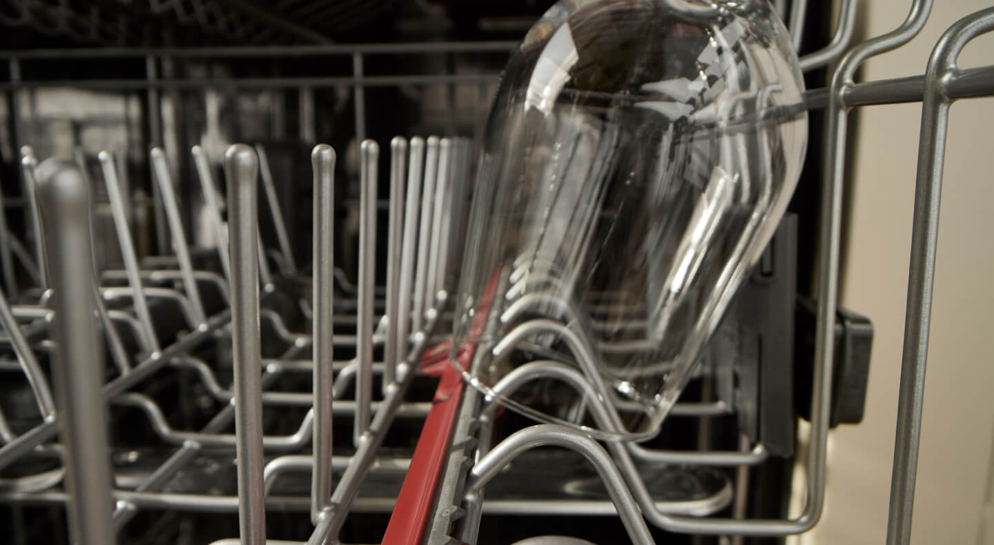 Close-up of wine glass inside a dishwasher