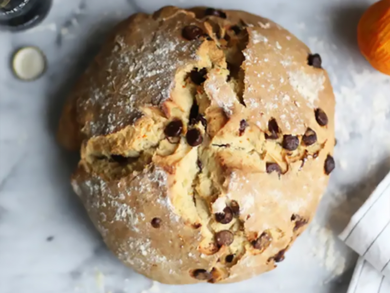 A loaf of bread with chocolate chips baked inside
