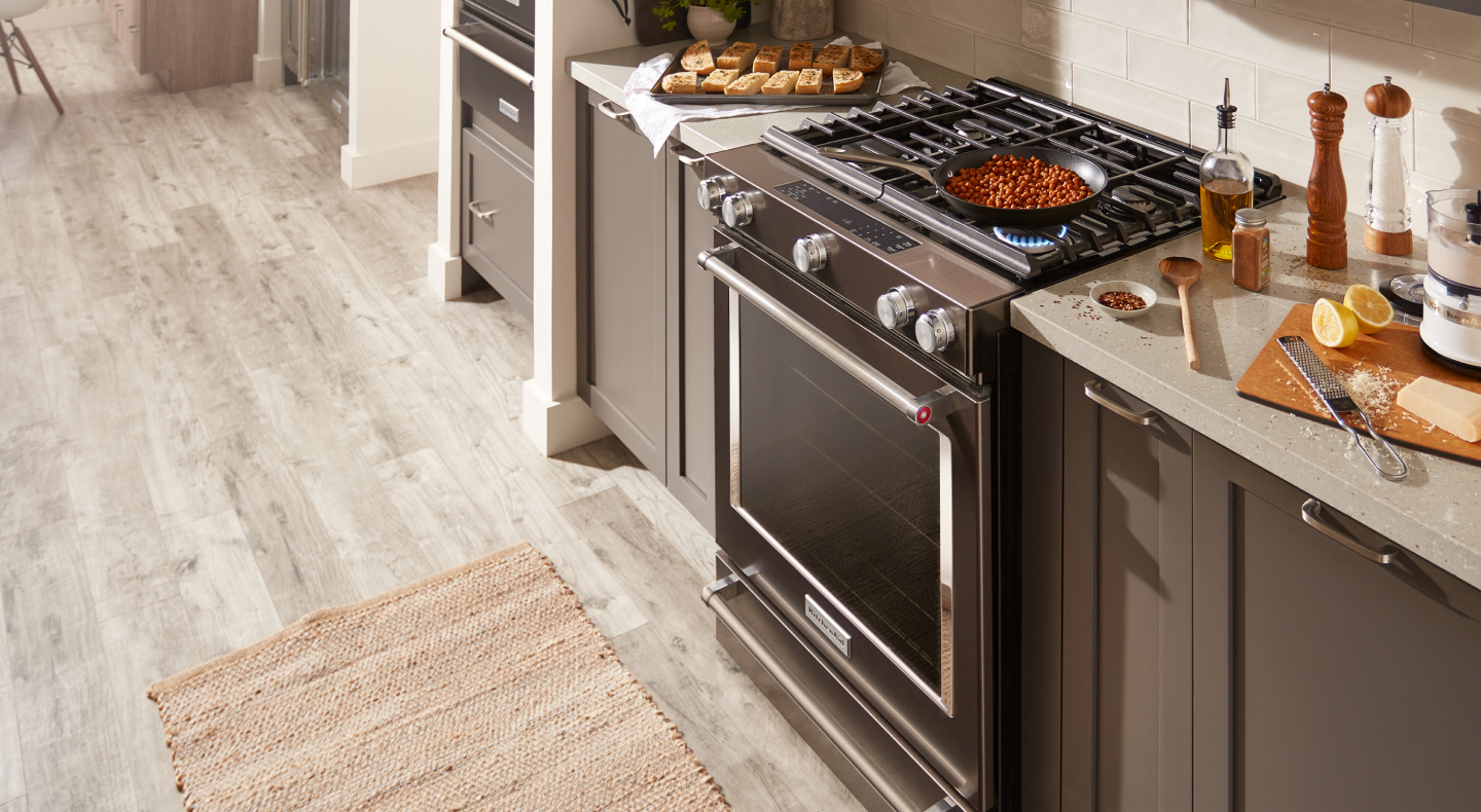 A dish cooking on a KitchenAid® gas stove