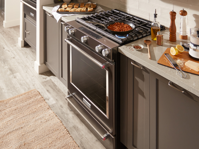 A dish cooking on a KitchenAid® gas stove