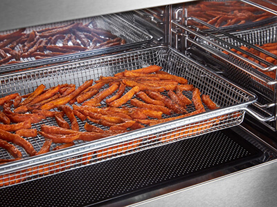 Sweet potato fries in an air fryer basket