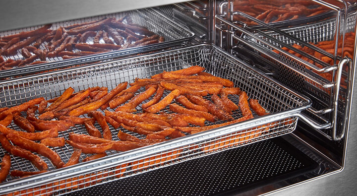 Sweet potato fries in an air fryer basket