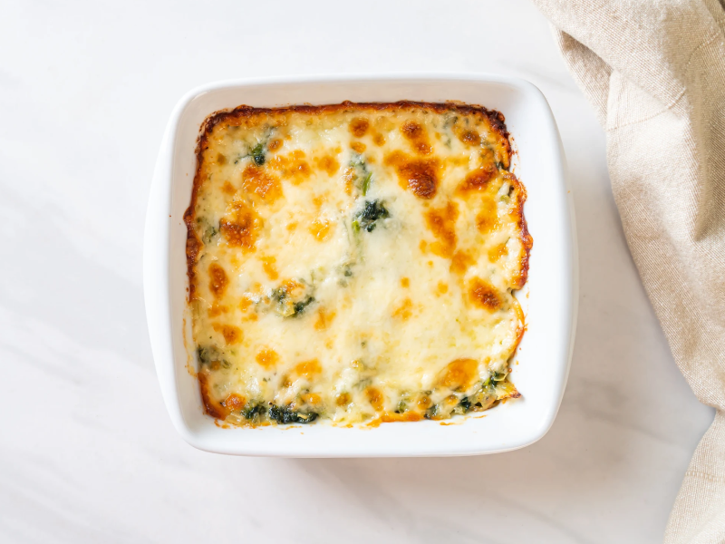 A cheesy-looking dip in a white dish