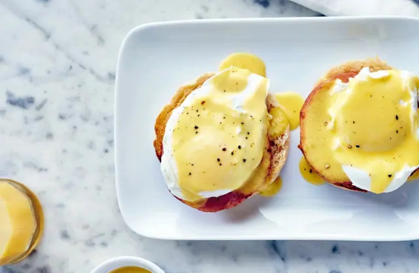 Toasted bagel with vegan eggs on a plate