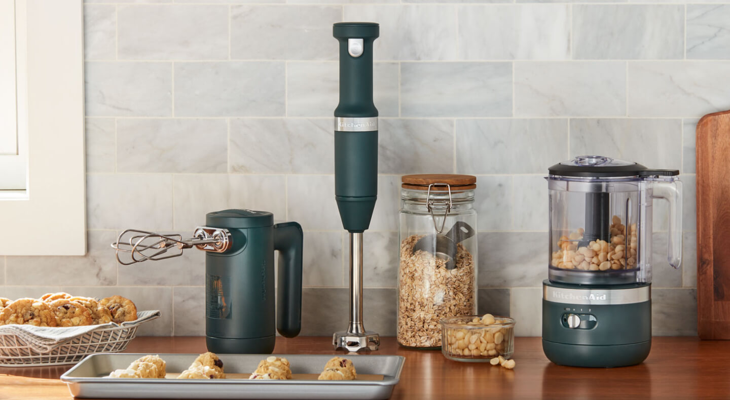 KitchenAid® black cordless hand mixer, hand blender and food chopper on a countertop