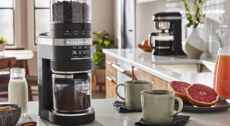  KitchenAid® coffee grinder and two cups of coffee