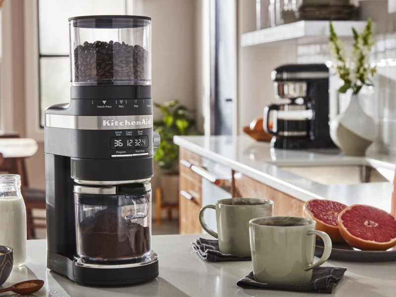  KitchenAid® coffee grinder and two cups of coffee