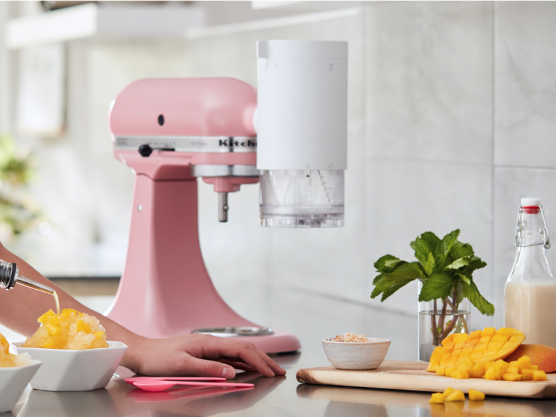 Person making mango flavored shaved ice with their KitchenAid® stand mixer.
