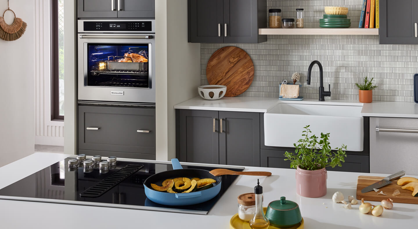 A kitchen, featuring a wall oven and cooktop