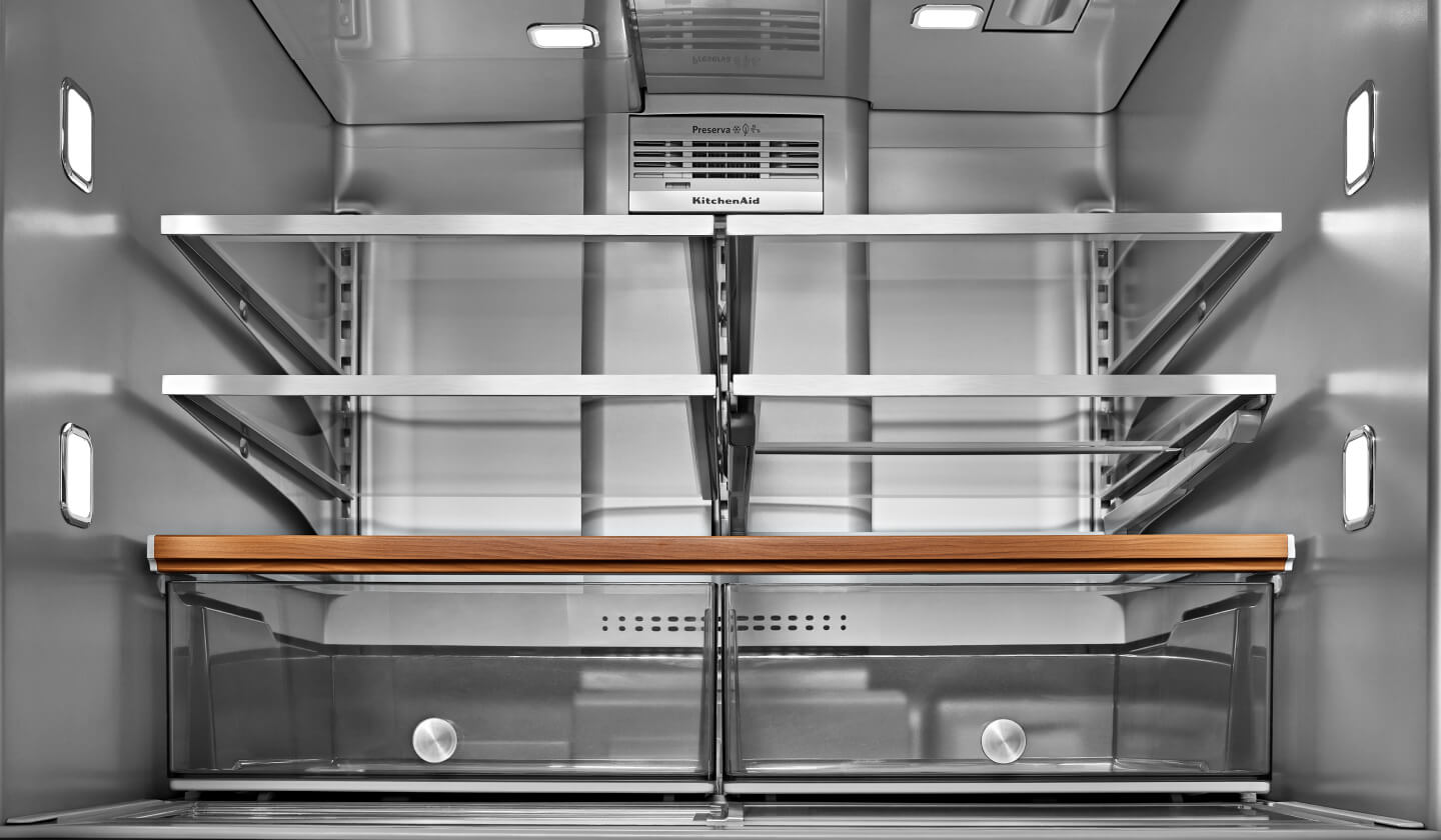 The inside of a well-lit KitchenAid® refrigerator 