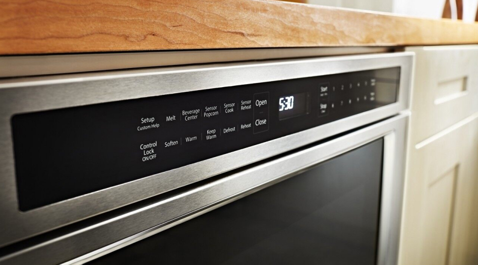 A close up of the controls on an undercounter KitchenAid® microwave