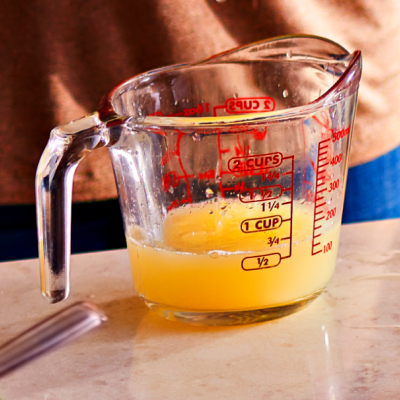 Ghee in measuring cup