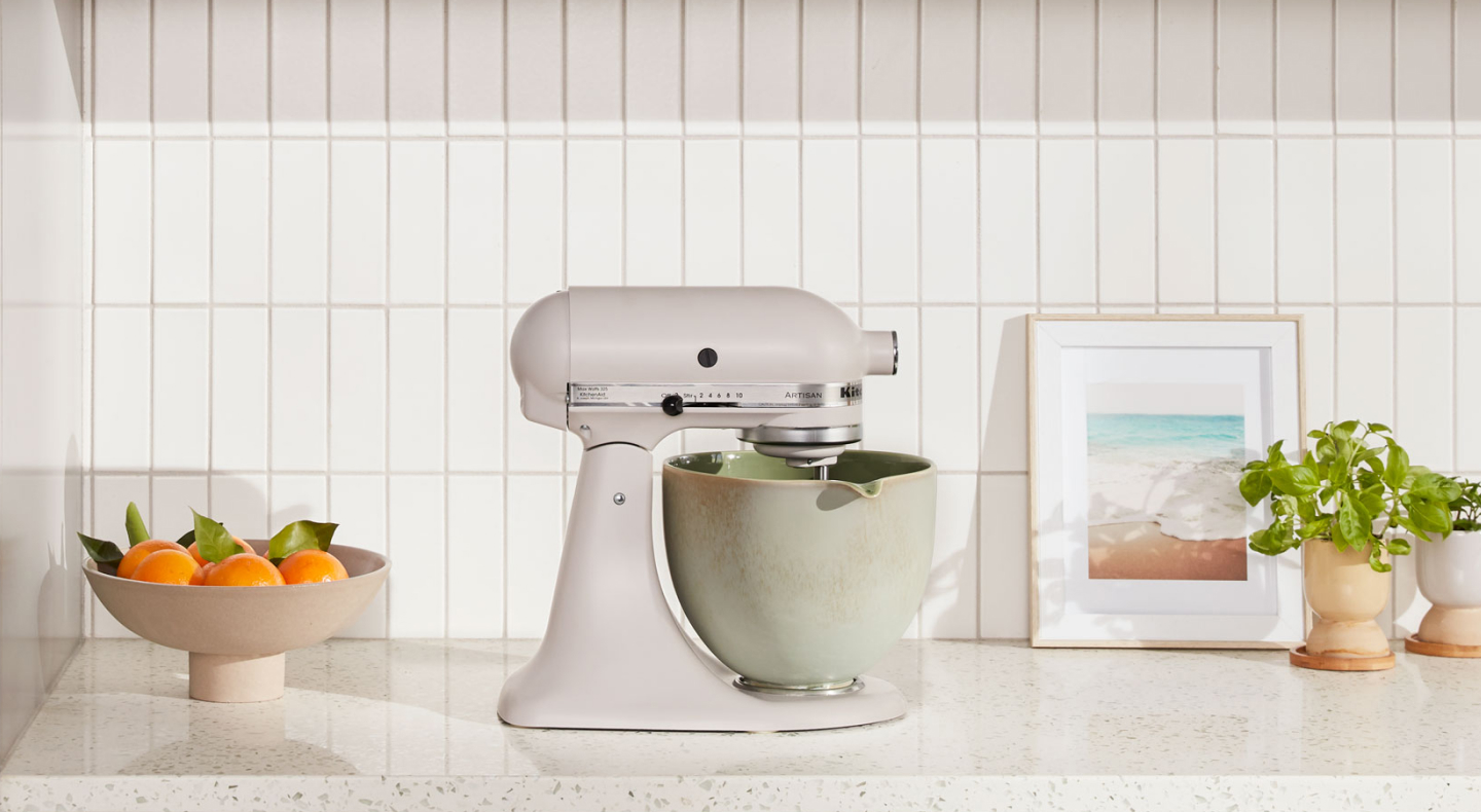 KitchenAid® stand mixer with green ceramic bowl on countertop