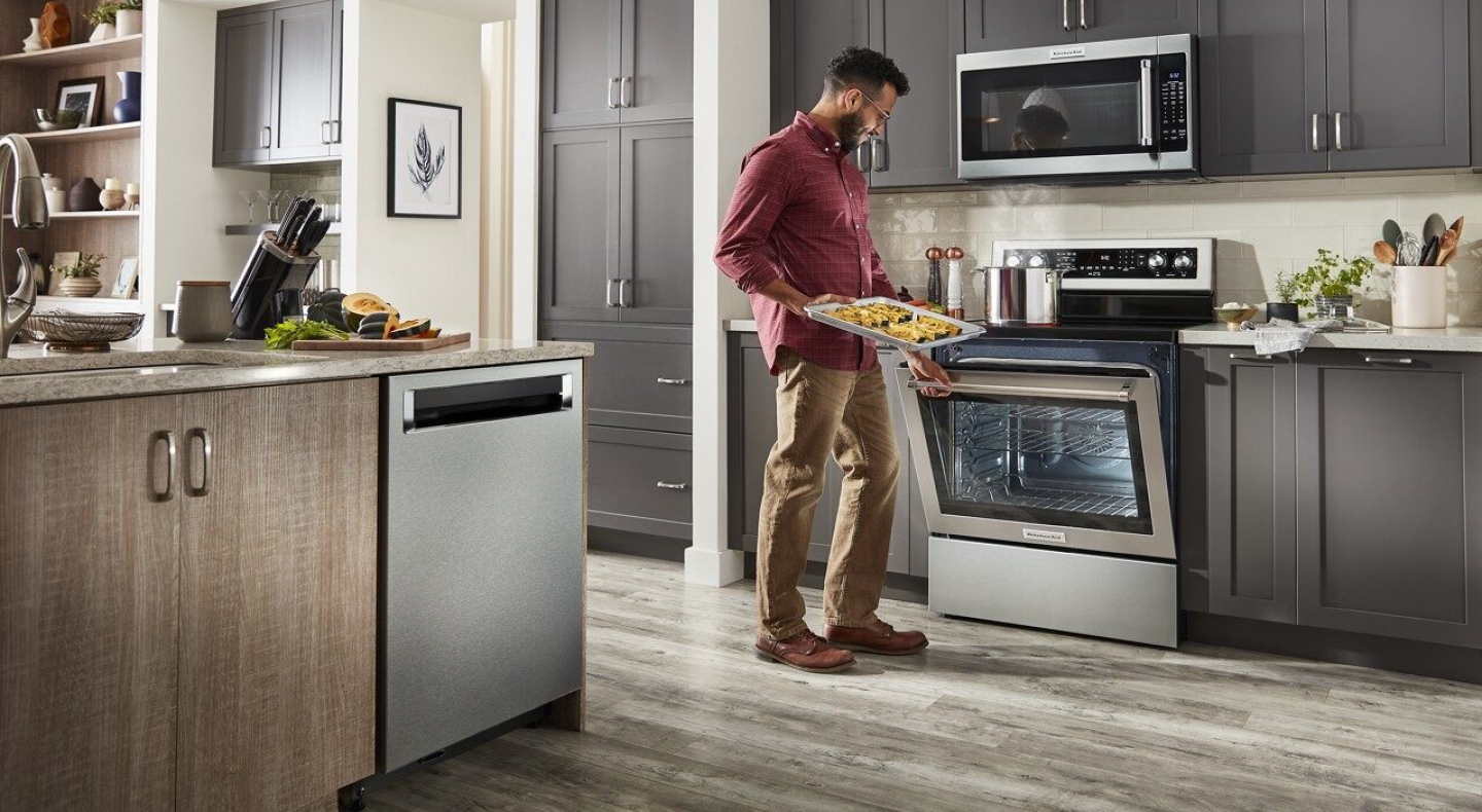Person baking snacks in KitchenAid® oven