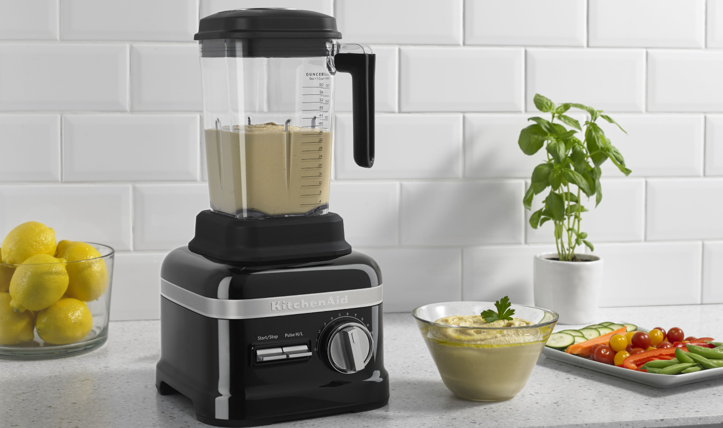 A KitchenAid® blender blending homemade hummus