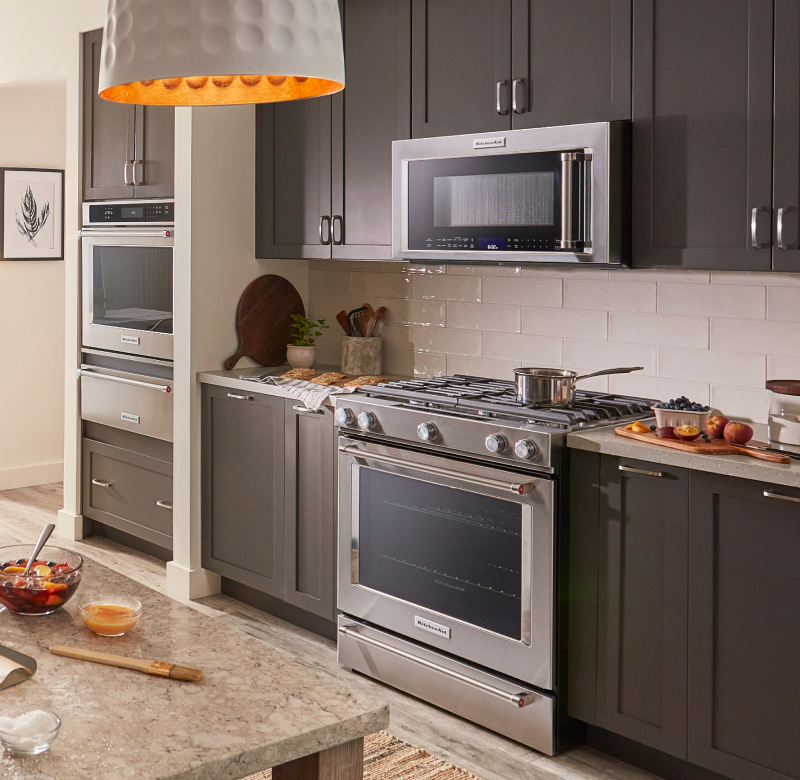 Kitchen with wall oven and range