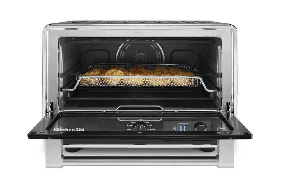 View of an open KitchenAid® countertop oven with food inside