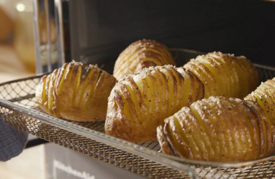 Close up of roasted potatoes in an air fryer basket