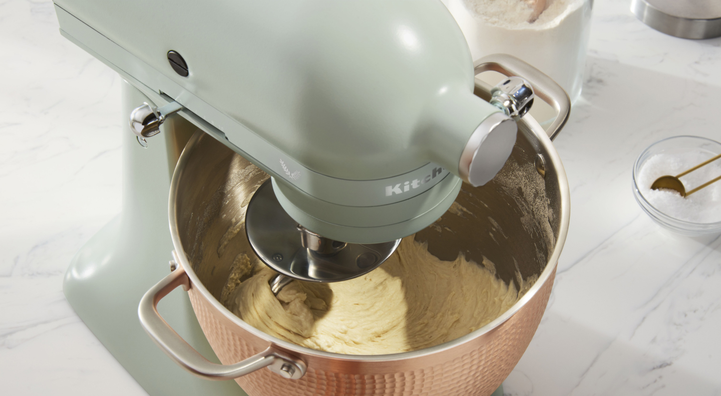 Batter being mixed inside a KitchenAid® stand mixer.
