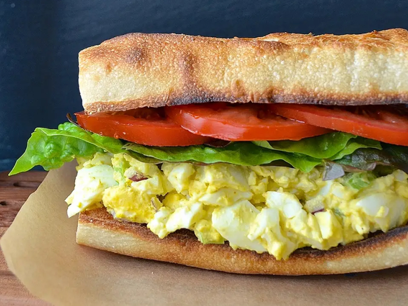 An egg, lettuce and tomato sandwich