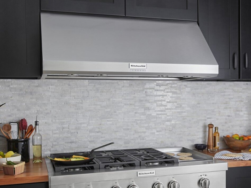 KitchenAid® wall canopy range hood above KitchenAid® gas stovetop