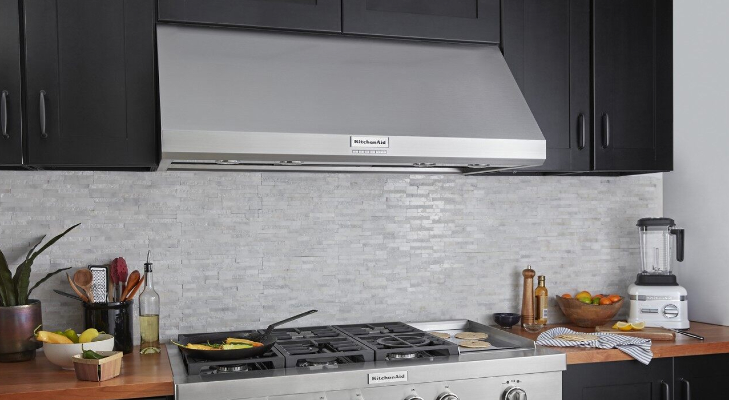 KitchenAid® wall canopy range hood above KitchenAid® gas stovetop