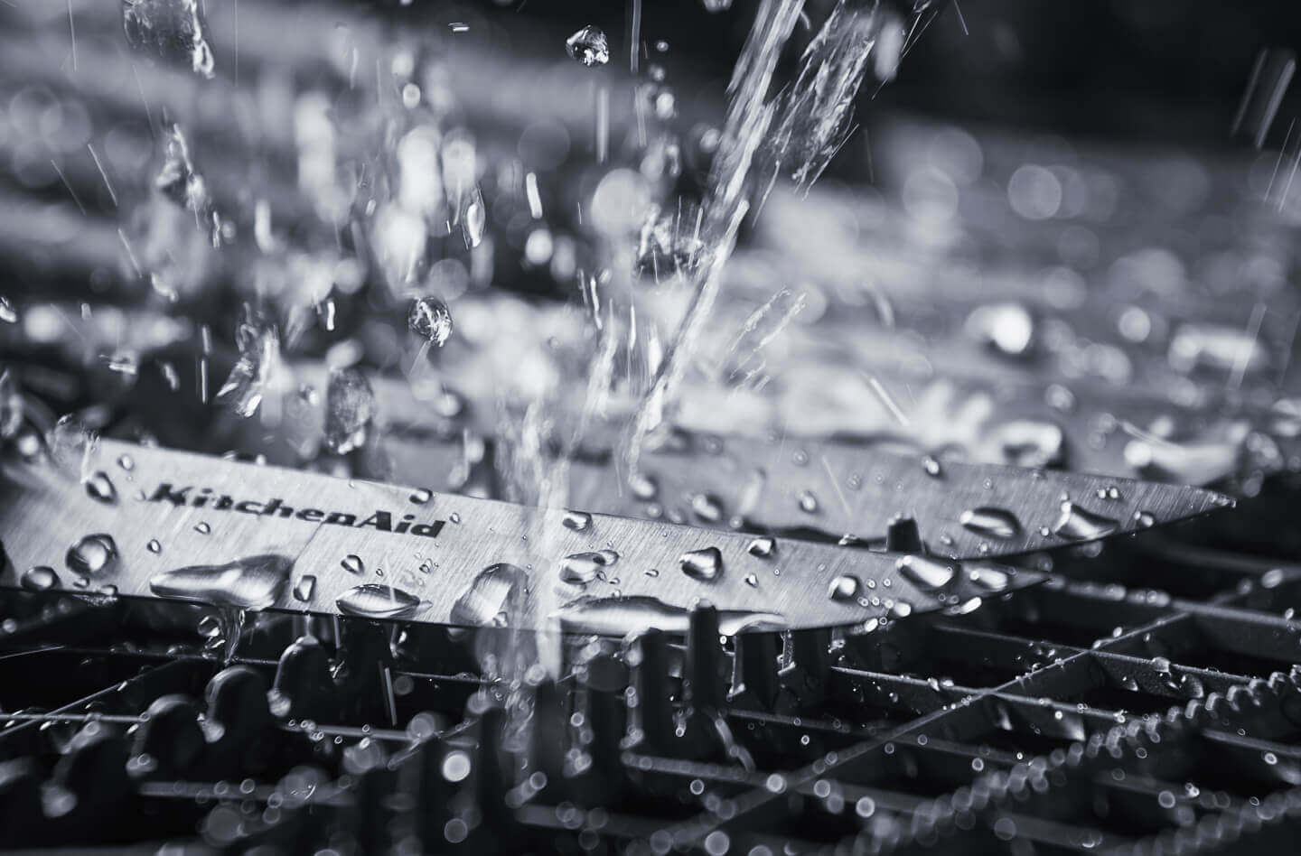 Clean water spraying knives inside of a dishwasher