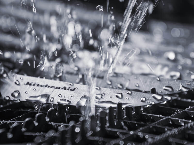 Clean water spraying knives inside of a dishwasher