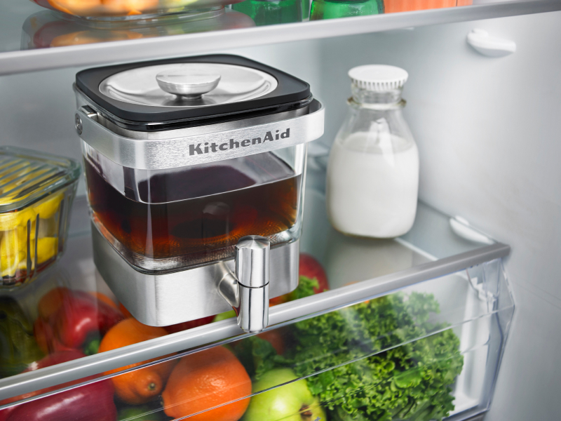 KitchenAid® cold brew maker filled with tea in a refrigerator 