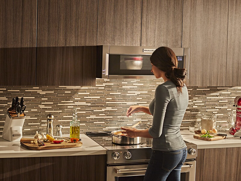 Person cooking on an electric range