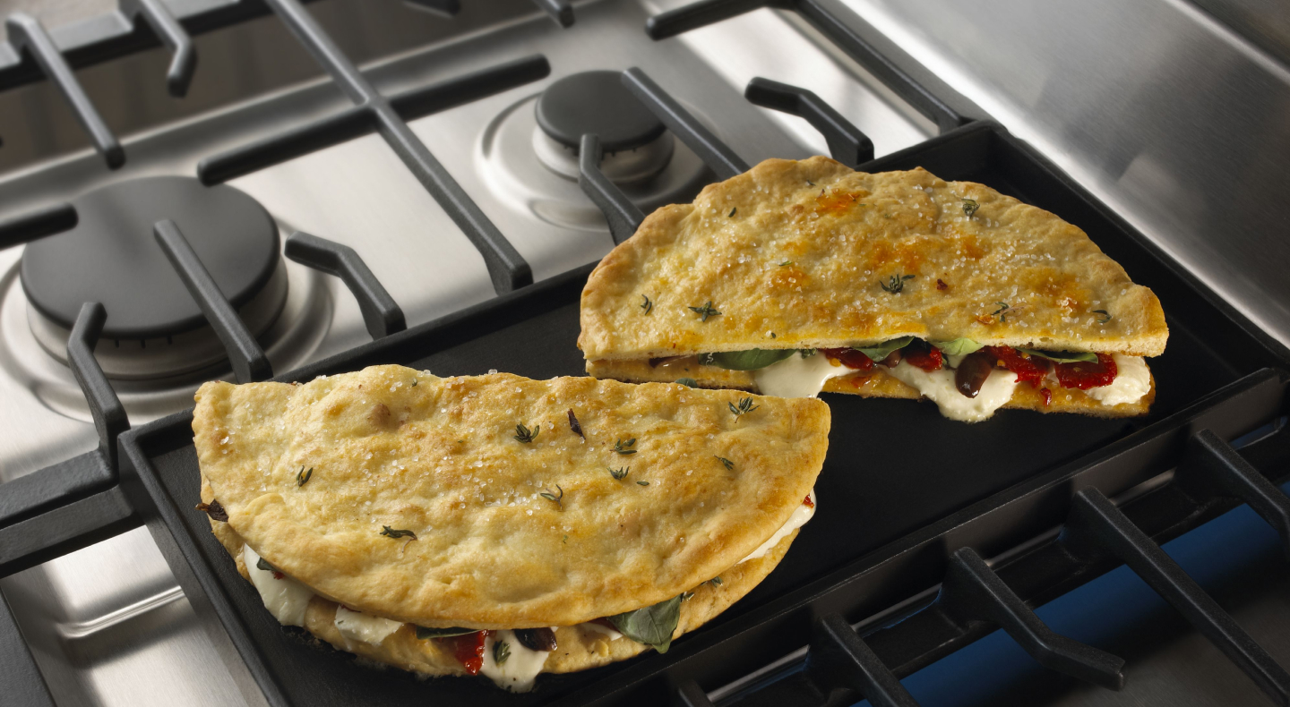 Stuffed pita bread on a griddle