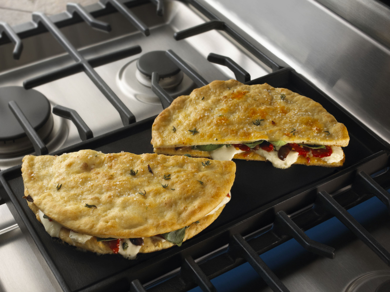 Stuffed pita bread on a griddle