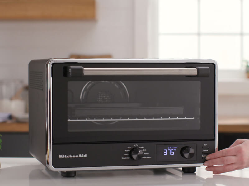 A black KitchenAid® countertop oven