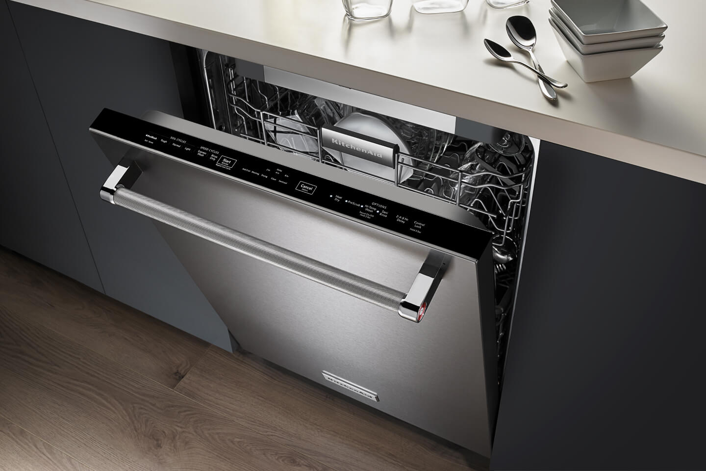 Stainless steel KitchenAid® top control dishwasher filled with dishes